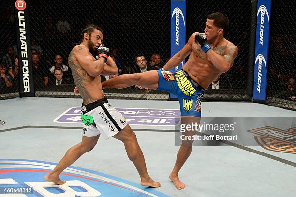 Anthony 'Showtime' Pettis kicks Benson Henderson in their UFC lightweight championship bout at BMO Harris Bradley Center on August 31, 2013 in...