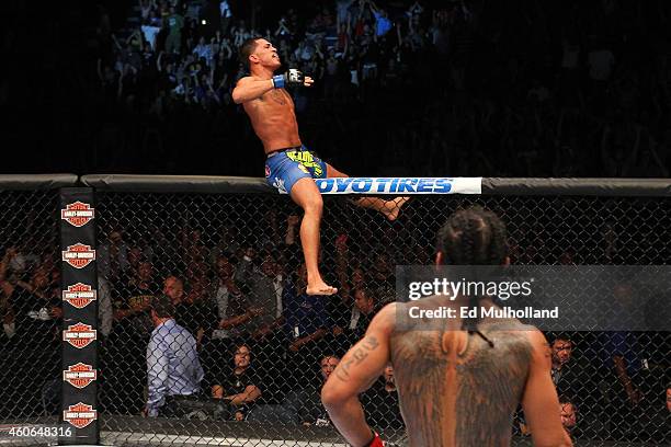 Anthony 'Showtime' Pettis celebrates after defeating Benson Henderson in their UFC lightweight championship bout at BMO Harris Bradley Center on...