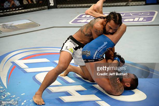 Anthony Pettis attempts to submit Benson Henderson in their UFC lightweight championship bout at BMO Harris Bradley Center on August 31, 2013 in...