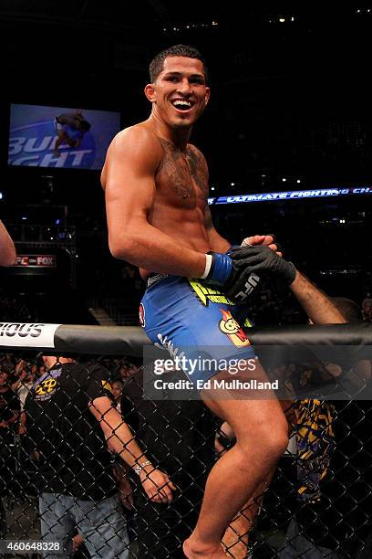 Anthony 'Showtime' Pettis celebrates after defeating Benson Henderson in their UFC lightweight championship bout at BMO Harris Bradley Center on...