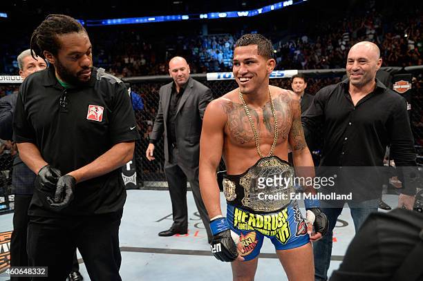 Anthony 'Showtime' Pettis celebrates with the championship belt after defeating Benson henderson in their UFC lightweight championship bout at BMO...