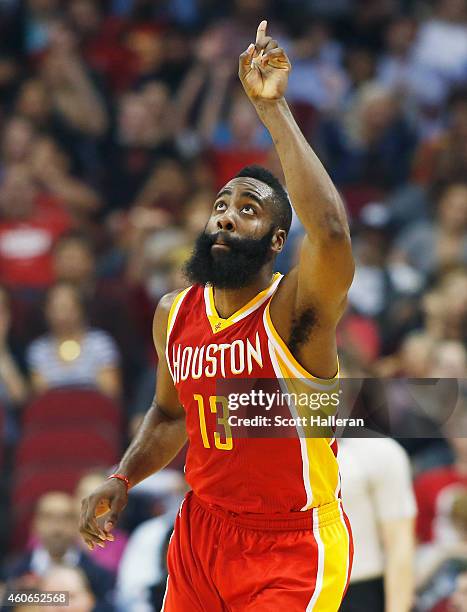 James Harden of the Houston Rockets celebrates a three-point shot during their game against the New Orleans Pelicans at the Toyota Center on...