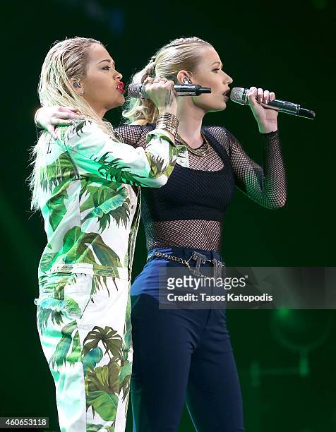 Rapper Iggy Azalea and singer Rita Ora perform onstage during 103.5 KISS FM's Jingle Ball 2014 at Allstate Arena on December 18, 2014 in Chicago,...