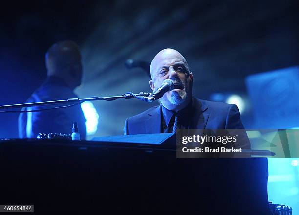 Musician Billy Joel performs at Madison Square Garden on December 18, 2014 in New York City.