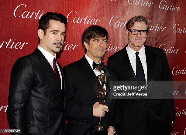 Actor Colin Farrell, composer Thomas Newman and writer/director John Lee Hancock pose with the Frederick Loewe Award for Film Composing for "Saving...