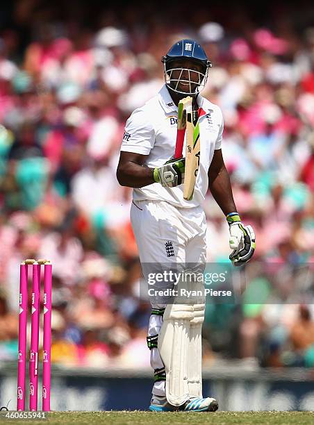 Michael Carberry of England has his bat broken by a delivery from Ryan Harris of Australia during day three of the Fifth Ashes Test match between...