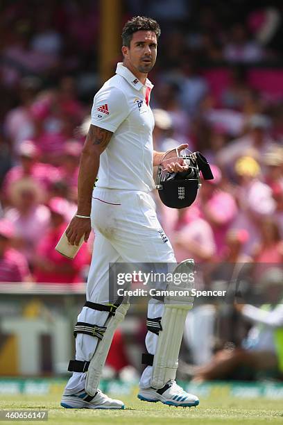 Kevin Pietersen of England walks off the field after being dismissed by Ryan Harris of Australia during day three of the Fifth Ashes Test match...