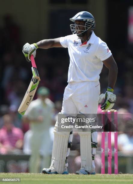 Michael Carberry of England holds up his broken bat during day three of the Fifth Ashes Test match between Australia and England at Sydney Cricket...