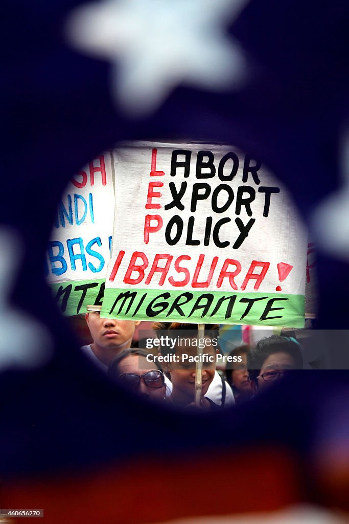 In commemoration of International Migrant's Day,  members of...