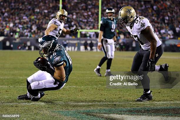 Zach Ertz of the Philadelphia Eagles scores a 3 yard touchdown pass from Nick Foles in the fourth quarter against the New Orleans Saints to take the...