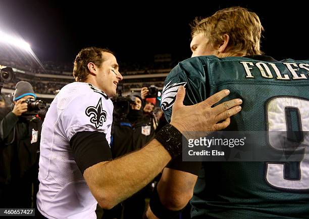 Drew Brees of the New Orleans Saints talks with Nick Foles of the Philadelphia Eagles after their NFC Wild Card Playoff game at Lincoln Financial...