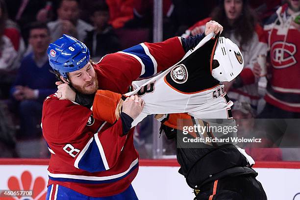 Brandon Prust of the Montreal Canadiens and Clayton Stoner of the Anaheim Ducks fight during the NHL game at the Bell Centre on December 18, 2014 in...