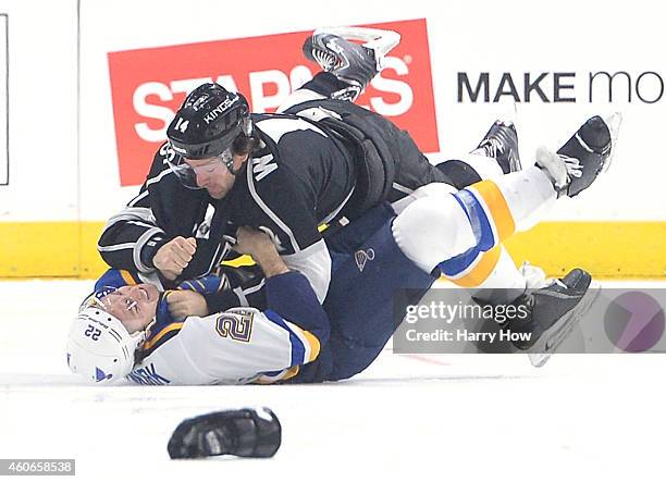 Justin Williams of the Los Angeles Kings knocks Kevin Shattenkirk of the St. Louis Blues to the ice during the first period at Staples Center on...