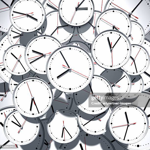 many watches showing a different time - uhr stock-fotos und bilder