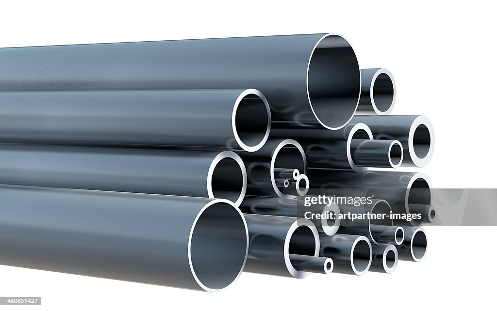 Stack of various steel pipes on white background