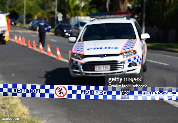 Police attend the scene of a mutliple stabbing in the suburb of Manoora on December 19, 2014 in Cairns, Australia. Eight children have been found...