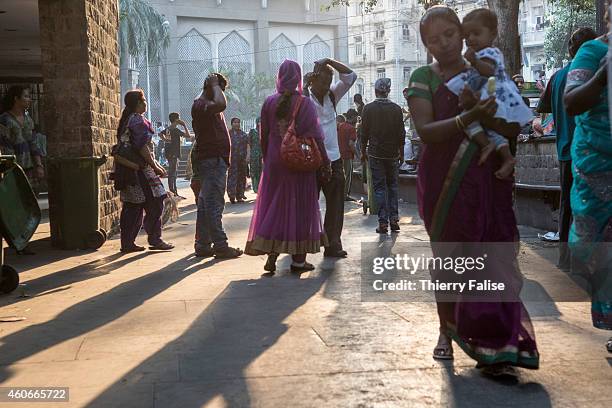 People walk in a downtown Mumbai street.