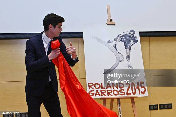 Lucas Dubourg, supervisor of French international races unveils the 2015 Roland Garros poster at La France en Chine on December 18, 2014 in Beijing,...