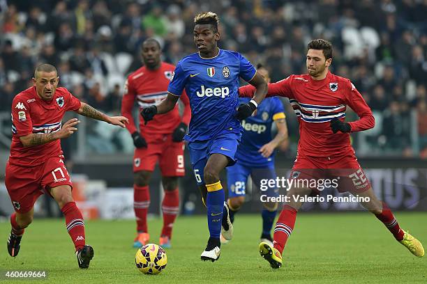 Paul Pogba of Juventus FC in action against Angelo Palombo and Luca Rizzo of UC Sampdoria during the Serie A match between Juventus FC and UC...