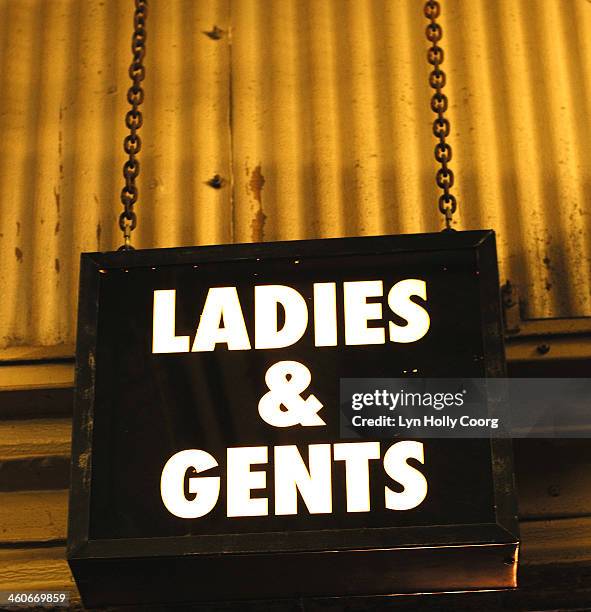 ladies and gents neon sign on chain - lyn holly coorg stockfoto's en -beelden