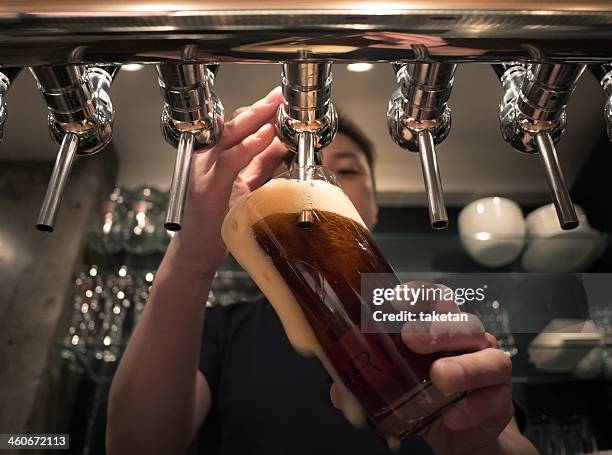 craft beer bar - beer pump stock pictures, royalty-free photos & images