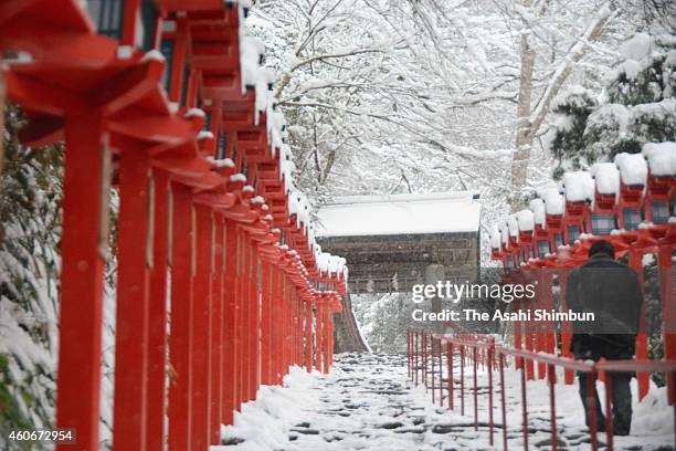 Man walks the snow covered main approach of the Kibune Shrine on December 18, 2014 in Kyoto, Japan. The Japan Meteorological Agency continues to call...