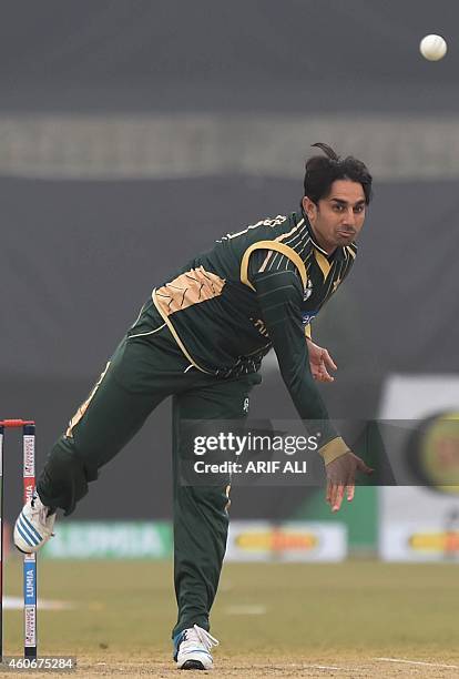 Pakistani spinner Saeed Ajmal delivers a ball during a one-day match with Kenya at the Gaddafi Cricket stadium in Lahore on December 19, 2014. Former...