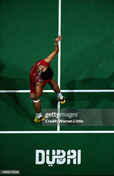 Kento Momota of Japan in action against Tommy Sugiarto of Indonesia during the Men's Singles Group B match on day three of the BWF Destination Dubai...