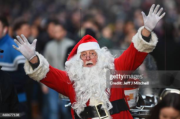 Papa John collects for Yorkhill Hospital as shoppers look for Christmas gifts on the Buchanan street on December 19, 2014 in Glasgow,Scotland. With...