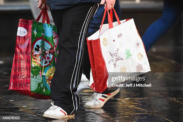 Shoppers look for Christmas gifts on the high street on December 19, 2014 in Glasgow,Scotland. With less than a week until Christmas, traditional...