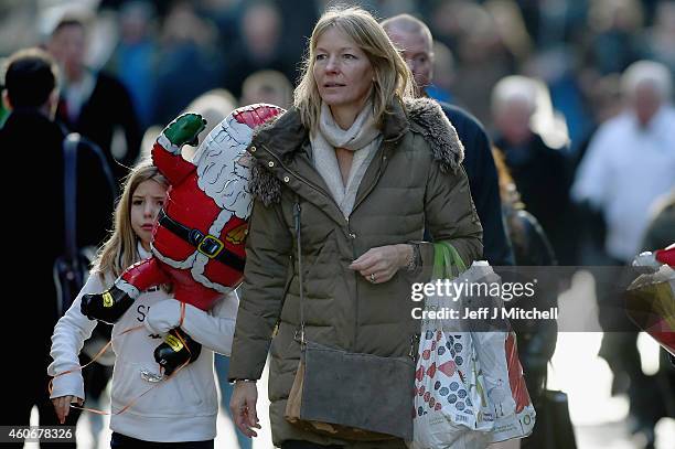 Shoppers look for Christmas gifts on the high street on December 19, 2014 in Glasgow,Scotland. With less than a week until Christmas, traditional...