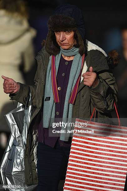 Shoppers look for Christmas gifts on the high street on December 19, 2014 in Glasgow,Scotland. With less than a week until Christmas, traditional...