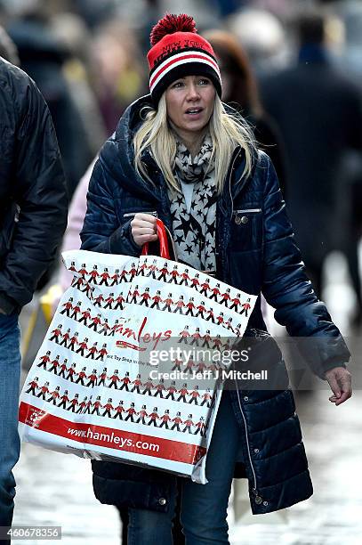 Shoppers look for Christmas gifts on the high street on December 19, 2014 in Glasgow,Scotland. With less than a week until Christmas, traditional...