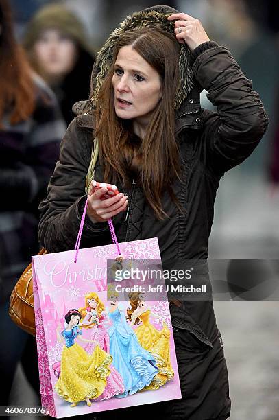 Shoppers look for Christmas gifts on the high street on December 19, 2014 in Glasgow,Scotland. With less than a week until Christmas, traditional...