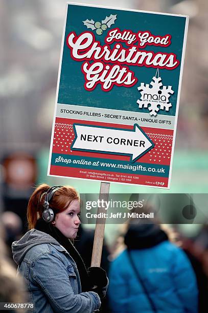 Shoppers look for Christmas gifts on the Buchanan street on December 19, 2014 in Glasgow,Scotland. With less than a week until Christmas, traditional...