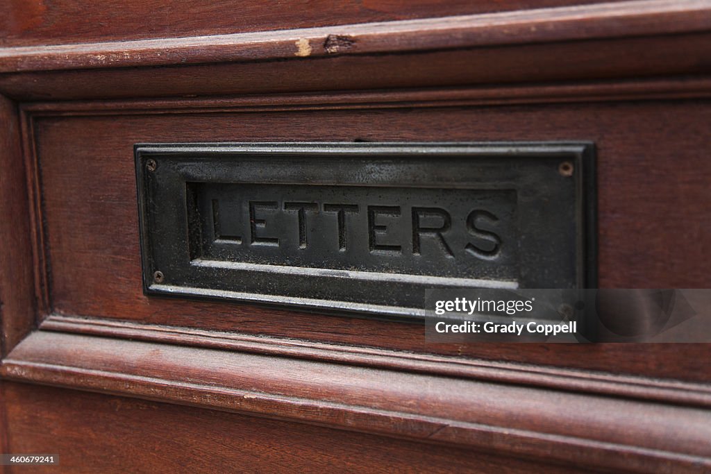 Letterbox in wooden front door