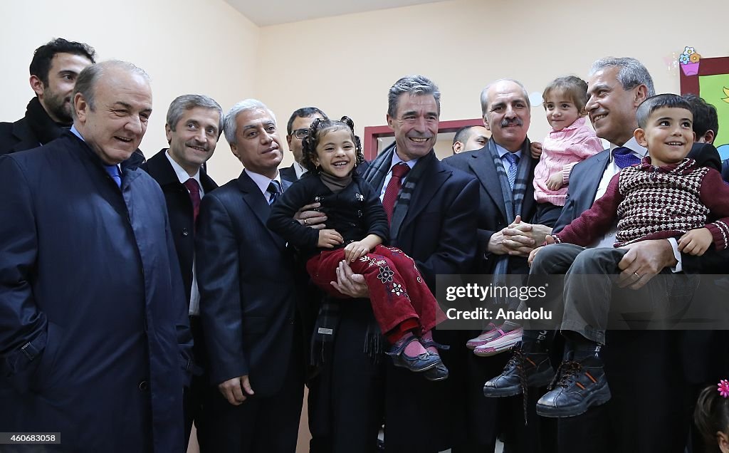 Former Secretary General of NATO Rasmussen visits a Syrian refugee camp in Turkey