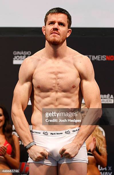 Dollaway of the United States poses on the scale after weighing in during the UFC weigh-in event inside the Ginasio Jose Correa on December 19, 2014...