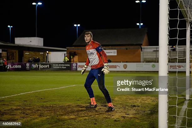 Arsenal goalkeeper Ryan Huddart warms up before the FA Youth Cup 3rd Round match between Arsenal and Reading at Meadow Park on December 19, 2014 in...