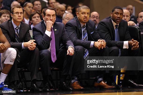 Assistant Coach Jon Scheyer, Head Coach Mike Krzyzewski, Associate Head Coach Jeff Capel and Assistant Coach Nate James of the Duke Blue Devils look...