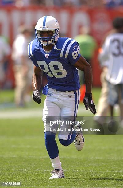 Marvin Harrison of the Indianapolis Colts participates in warm-ups before a game against the Cleveland Browns on September 08, 2003 at the Cleveland...