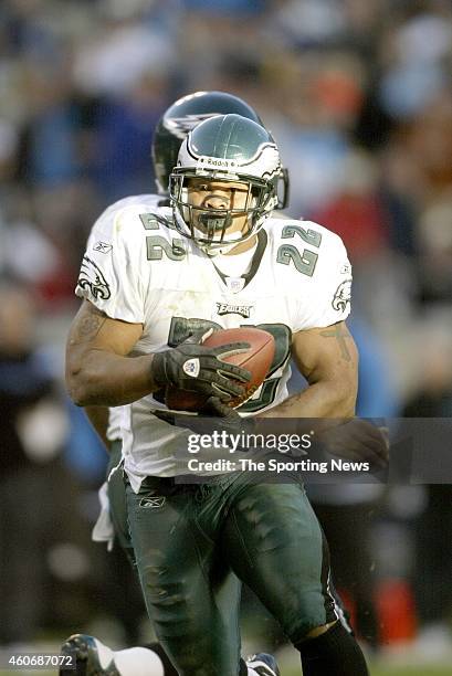 Duce Staley of the Philadelphia Eagles runs with the ball during a game against the Carolina Panthers on November 30, 2003 at Ericsson Stadium in...