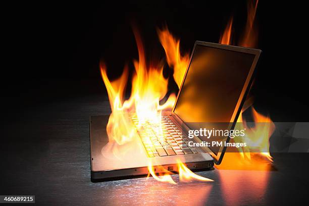 laptop computer on fire - damaged laptop stock pictures, royalty-free photos & images