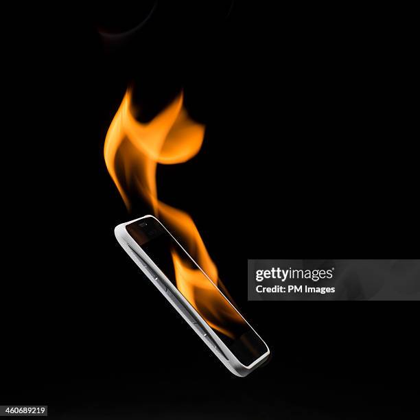 fire from smartphone - overheated stock pictures, royalty-free photos & images