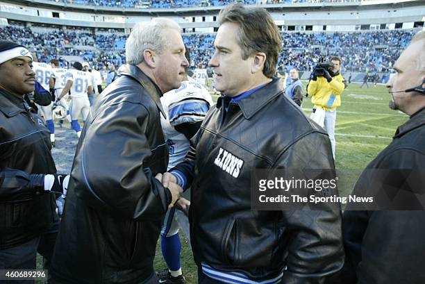 Head Coach John Fox of the Carolina Panthers and Head Coach Steve Mariucci of the Detroit Lions shake hands after a game on December 21, 2003 at...