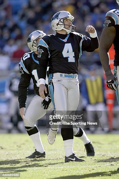 John Kasay and Todd Sauerbrun of the Carolina Panthers looks on after kicking a field goal during a game against the Detroit Lions on December 21,...