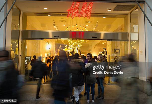The H&M logo is seen in the window display of a Hennes & Mauritz AB clothing fashion on Gran via street on December 19, 2014 in Madrid, Spain....