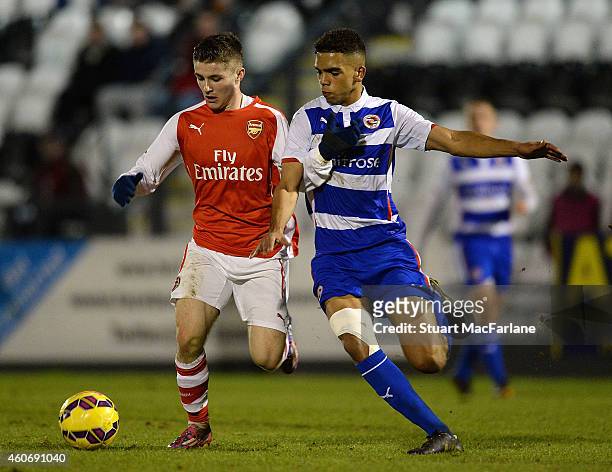 Dan Crowley of Arsenal breaks past Noor Husin of Reading during the FA Youth Cup 3rd Round match between Arsenal and Reading at Meadow Park on...