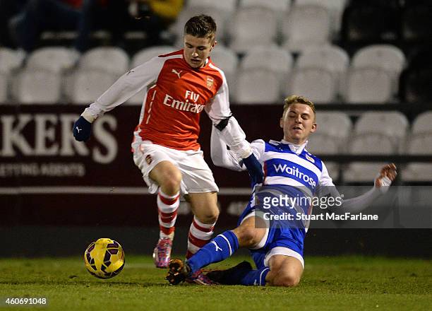 Dan Crowley of Arsenal is challenged by Jake Sheppard of Reading during the FA Youth Cup 3rd Round match between Arsenal and Reading at Meadow Park...