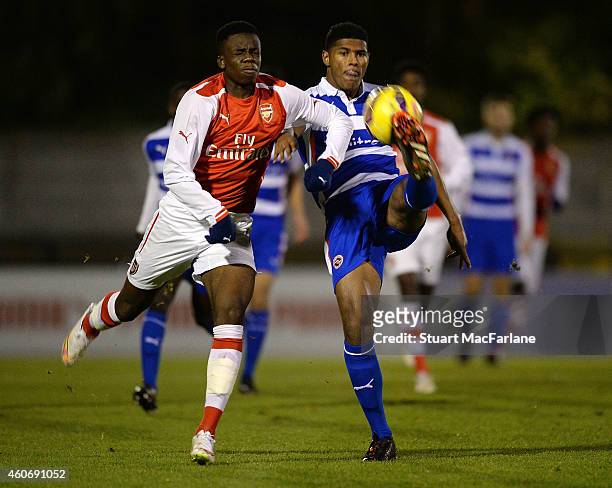 Stephy Mavididi of Arsenal challenges Zak Jules of Reading during the FA Youth Cup 3rd Round match between Arsenal and Reading at Meadow Park on...
